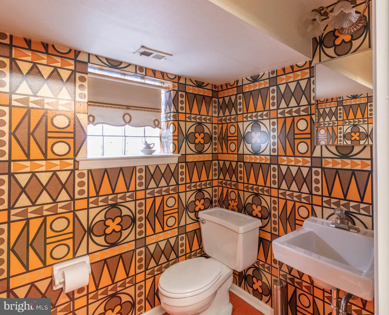 418 Densmore Road Philadelphia, PA 19116 - Photo 24 of 25 a white toilet sitting next to a shower curtain