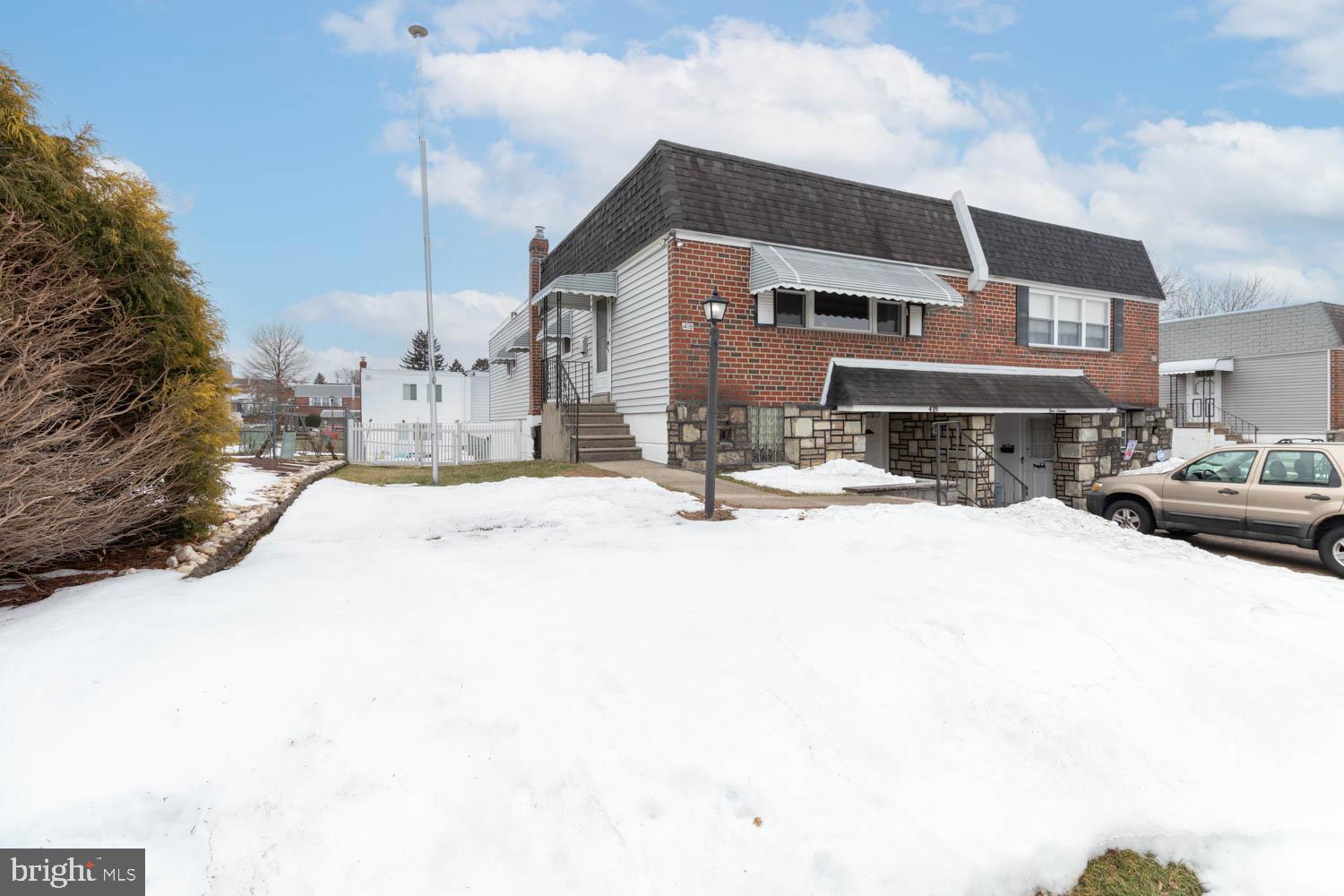 418 Densmore Road Philadelphia, PA 19116 - Photo 3 of 25 a street view with residential house and car parked