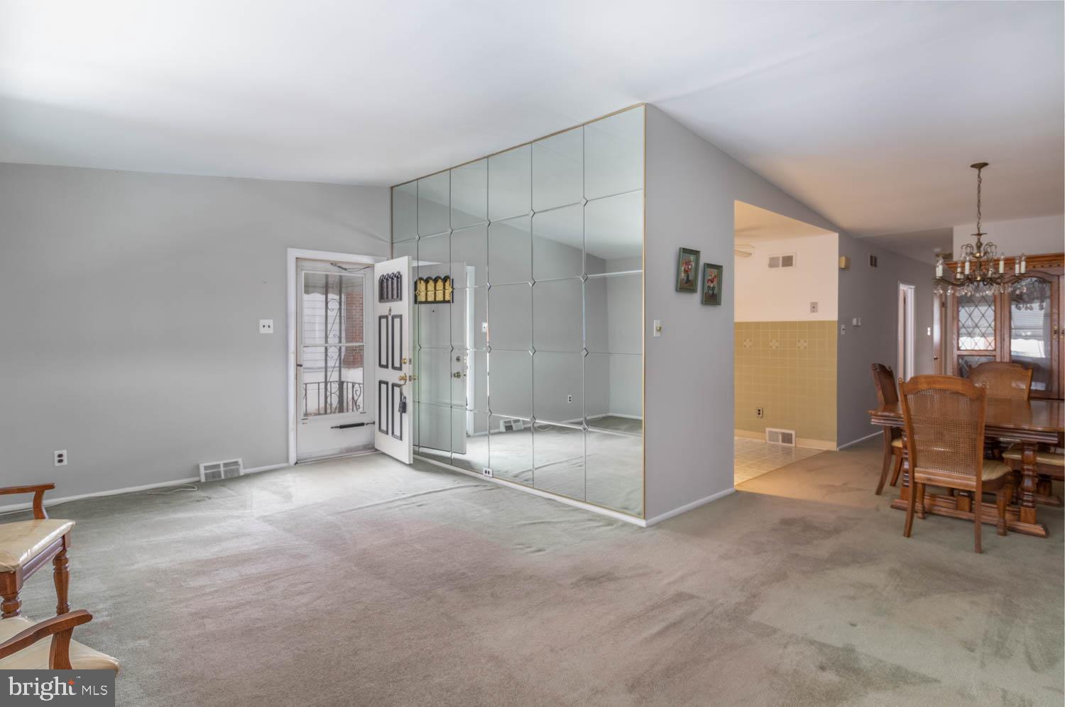 418 Densmore Road Philadelphia, PA 19116 - Photo 7 of 25 a view of empty room with wooden floor and windows