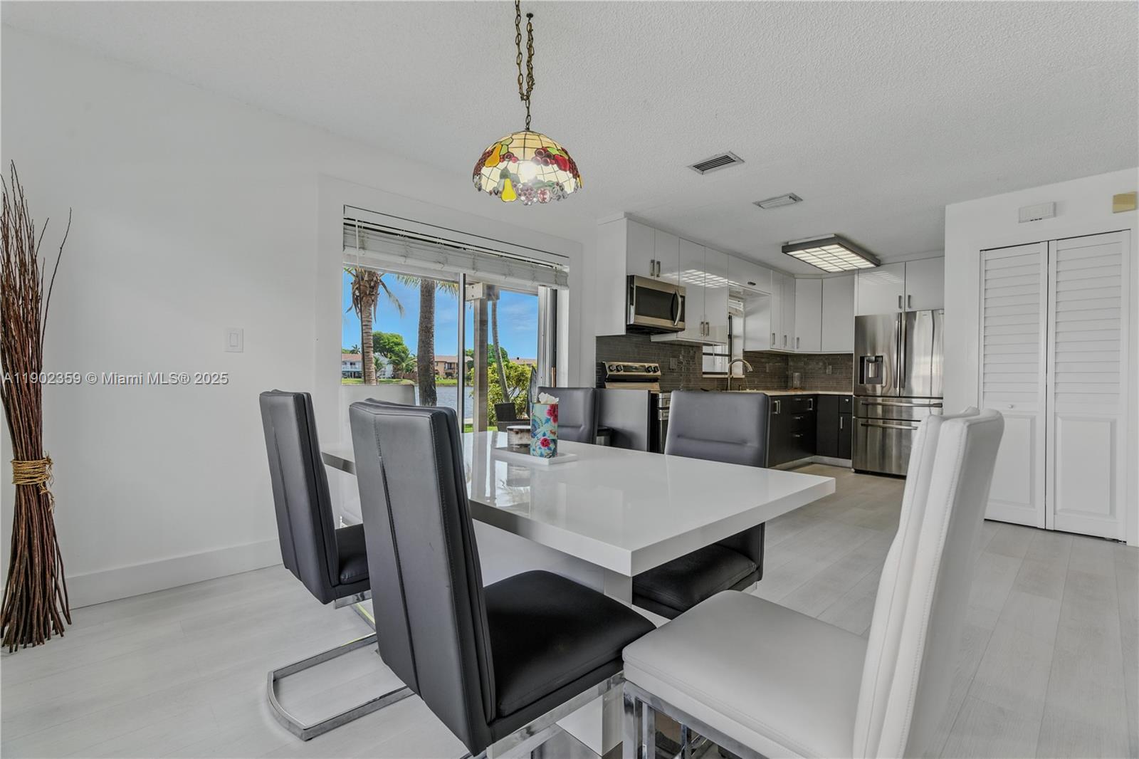 6825 Northwest 169th Street, Unit 54H Hialeah, FL 33015 - Photo 11 of 46 a view of a dining room with furniture