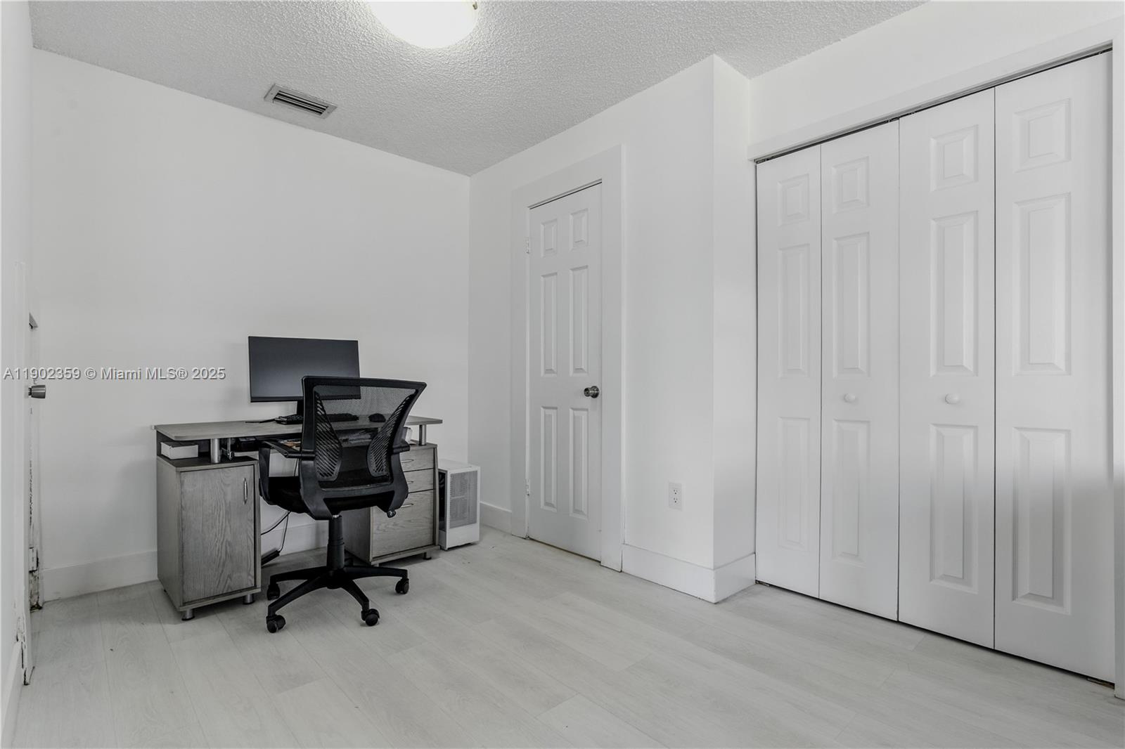 6825 Northwest 169th Street, Unit 54H Hialeah, FL 33015 - Photo 14 of 46 a view of a workspace with furniture