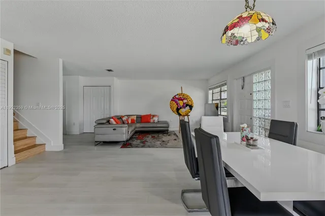 a bedroom with furniture and a flat screen tv