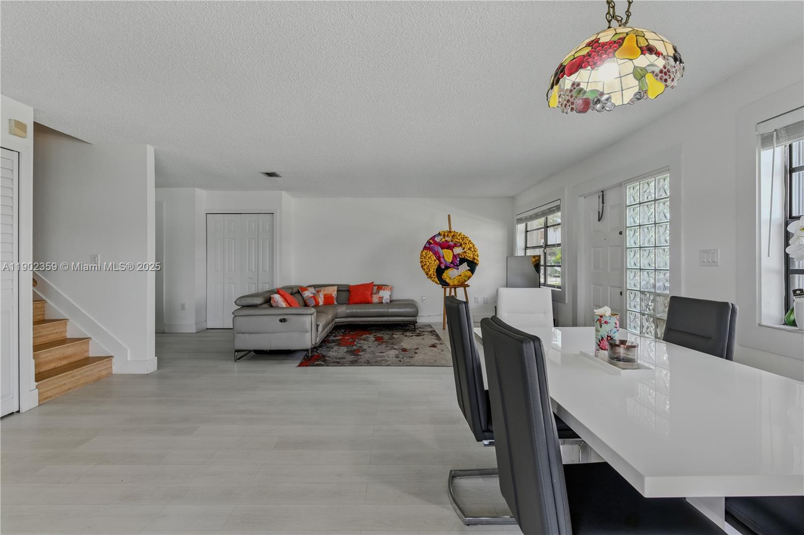 6825 Northwest 169th Street, Unit 54H Hialeah, FL 33015 - Photo 2 of 46 a bedroom with furniture and a flat screen tv