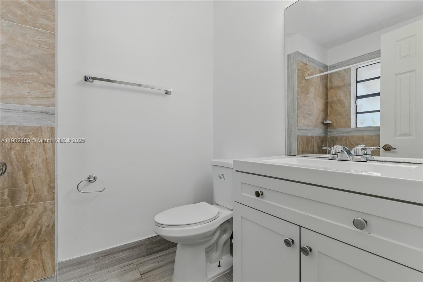 6825 Northwest 169th Street, Unit 54H Hialeah, FL 33015 - Photo 23 of 46 a bathroom with a sink a toilet and shower