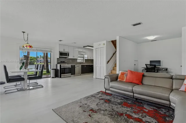 a living room with furniture and a rug