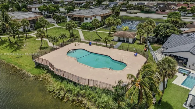 an aerial view of residential house with outdoor space and swimming pool