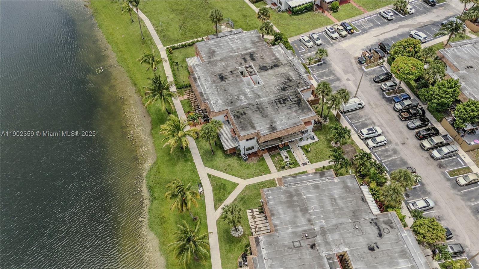 6825 Northwest 169th Street, Unit 54H Hialeah, FL 33015 - Photo 45 of 46 an aerial view of a residential houses with outdoor space