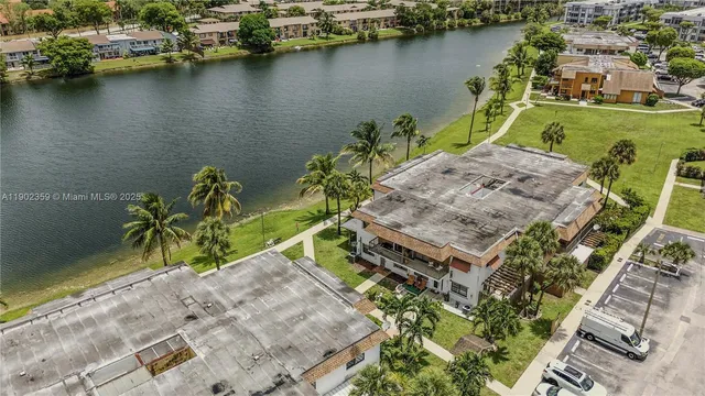 an aerial view of a house with a lake view