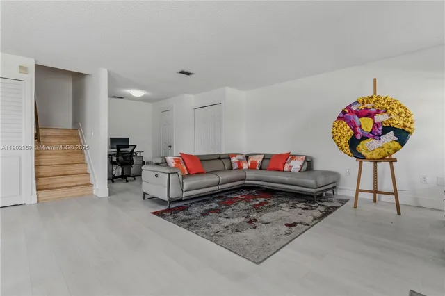 a living room with furniture and a table