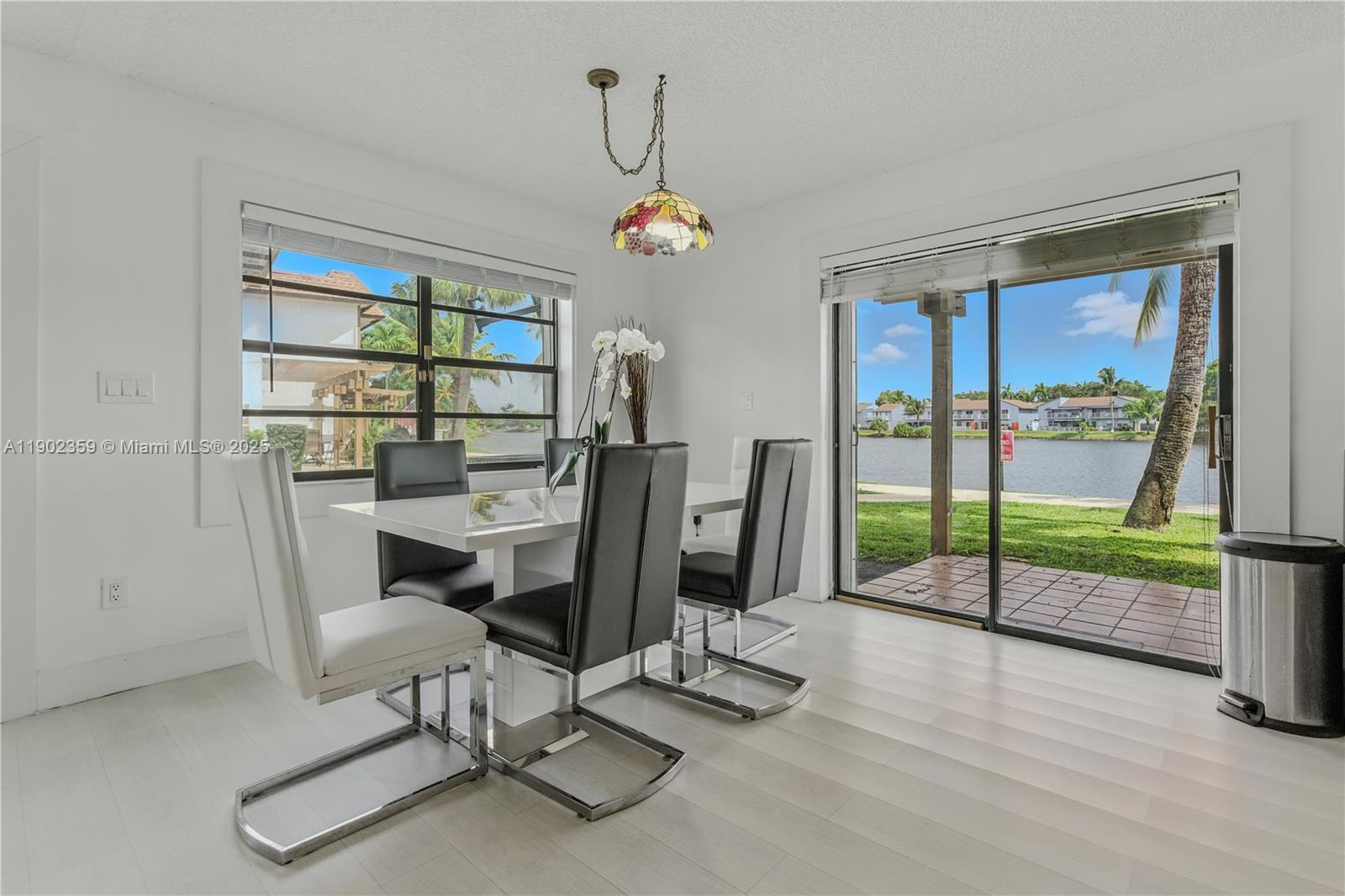 6825 Northwest 169th Street, Unit 54H Hialeah, FL 33015 - Photo 10 of 46 a view of a workspace with furniture and a window