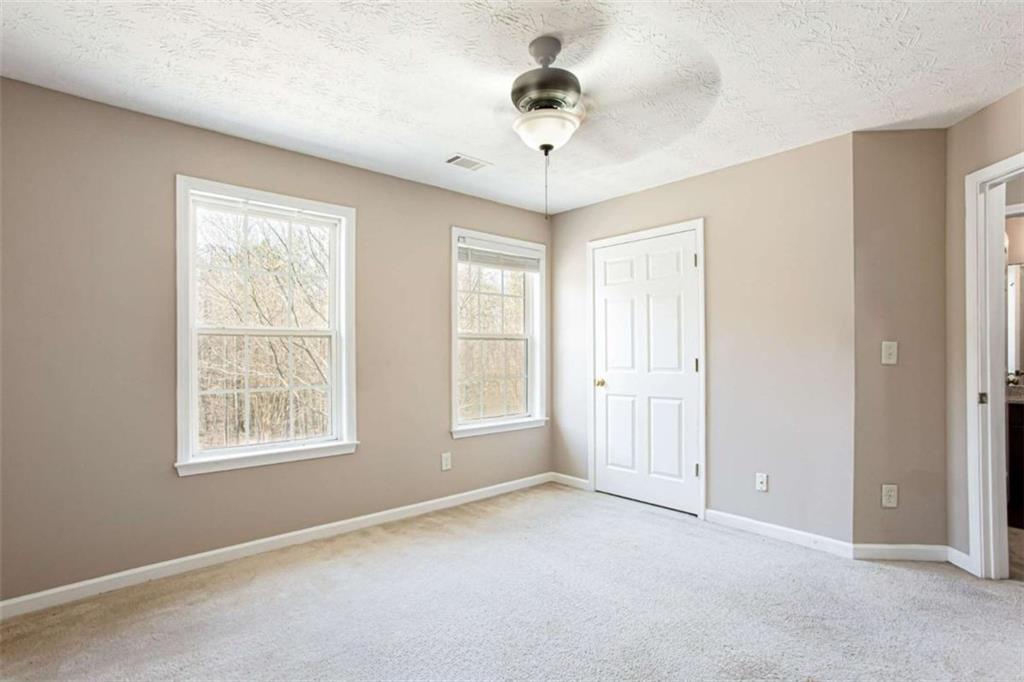 3721 Bogan Mill Road Northeast Buford, GA 30519 - Photo 29 of 58 a view of an empty room with a window