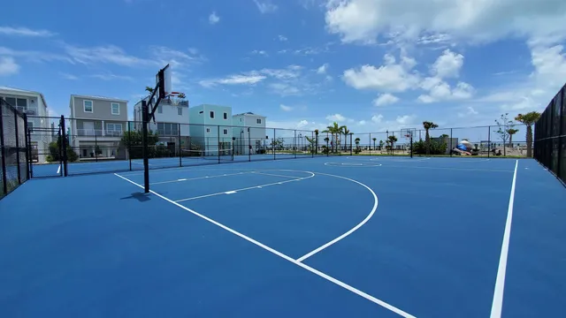 a view of a swimming pool and lounge chair