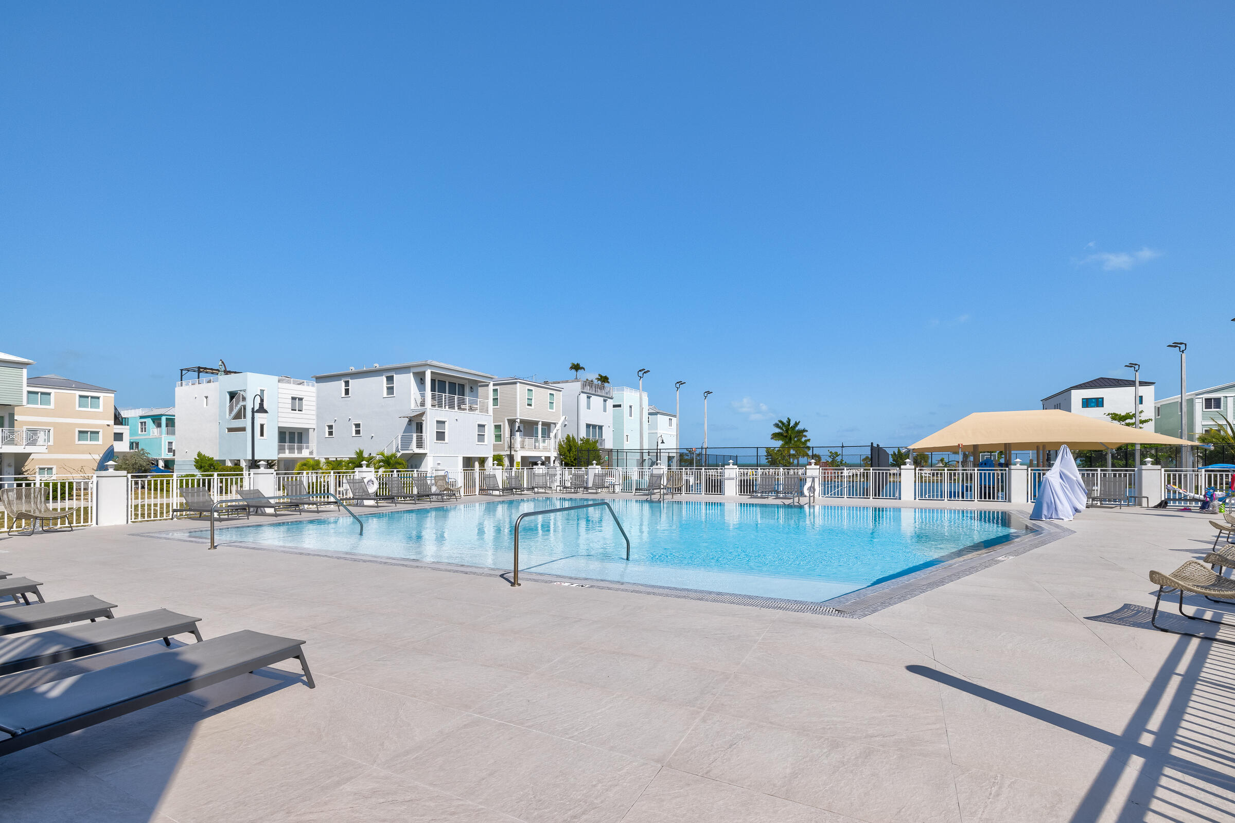 94825 Overseas Highway, Unit 68 Key Largo, FL 33037 - Photo 22 of 28 a view of a swimming pool and a patio