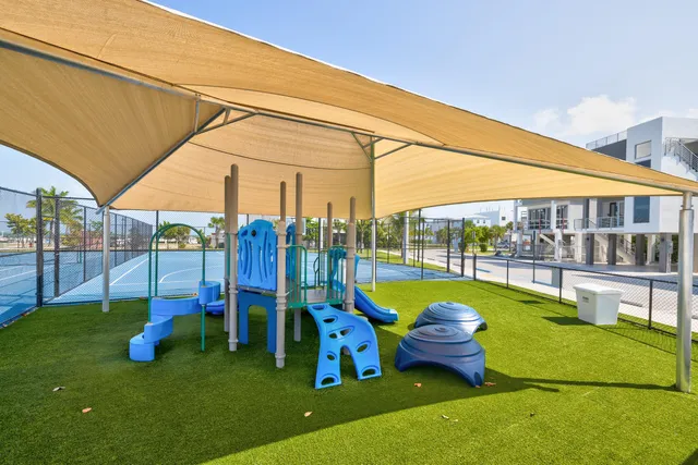 a view of a backyard with swimming pool