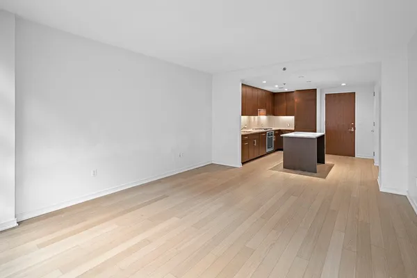 a view of kitchen and wooden floor