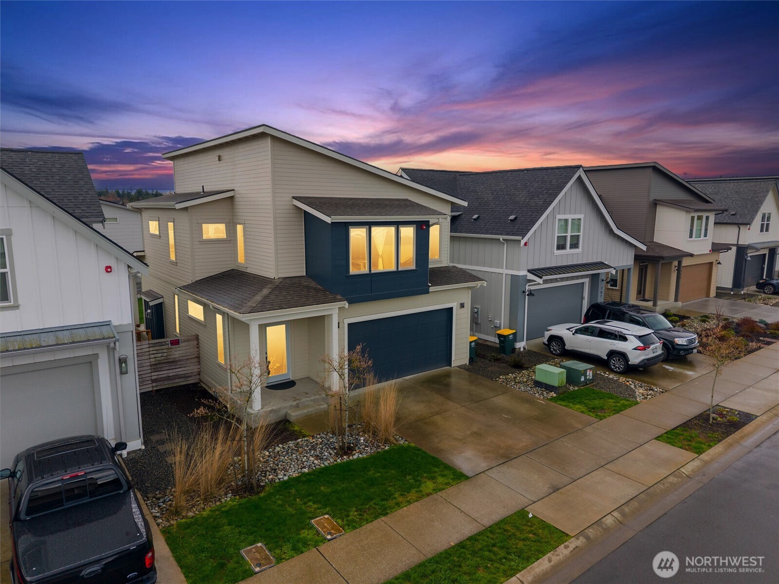 a view of a house with a patio and a yard