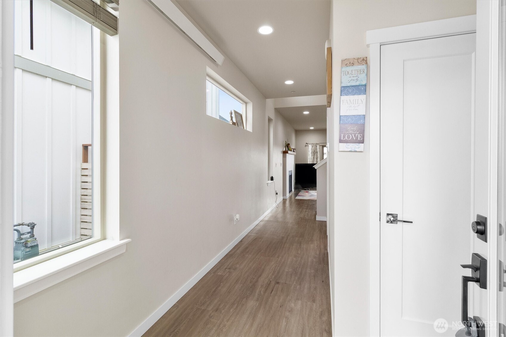 703 Northview Street Bellingham, WA 98226 - Photo 15 of 40 a view of a hallway with wooden floor and a bathroom