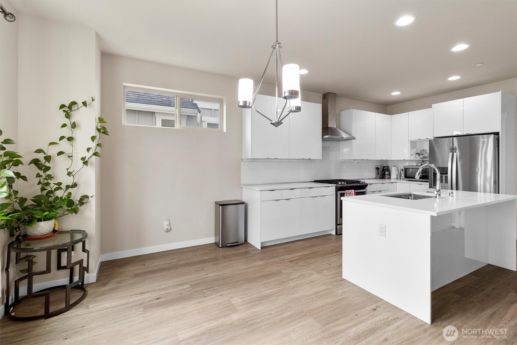 703 Northview Street Bellingham, WA 98226 - Photo 19 of 40 a kitchen with kitchen island white cabinets and stainless steel appliances