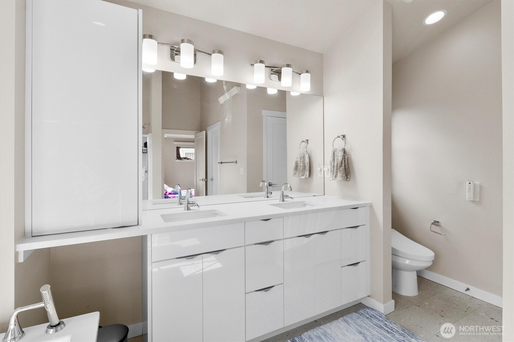 703 Northview Street Bellingham, WA 98226 - Photo 24 of 40 a bathroom with a double vanity sink and a mirror