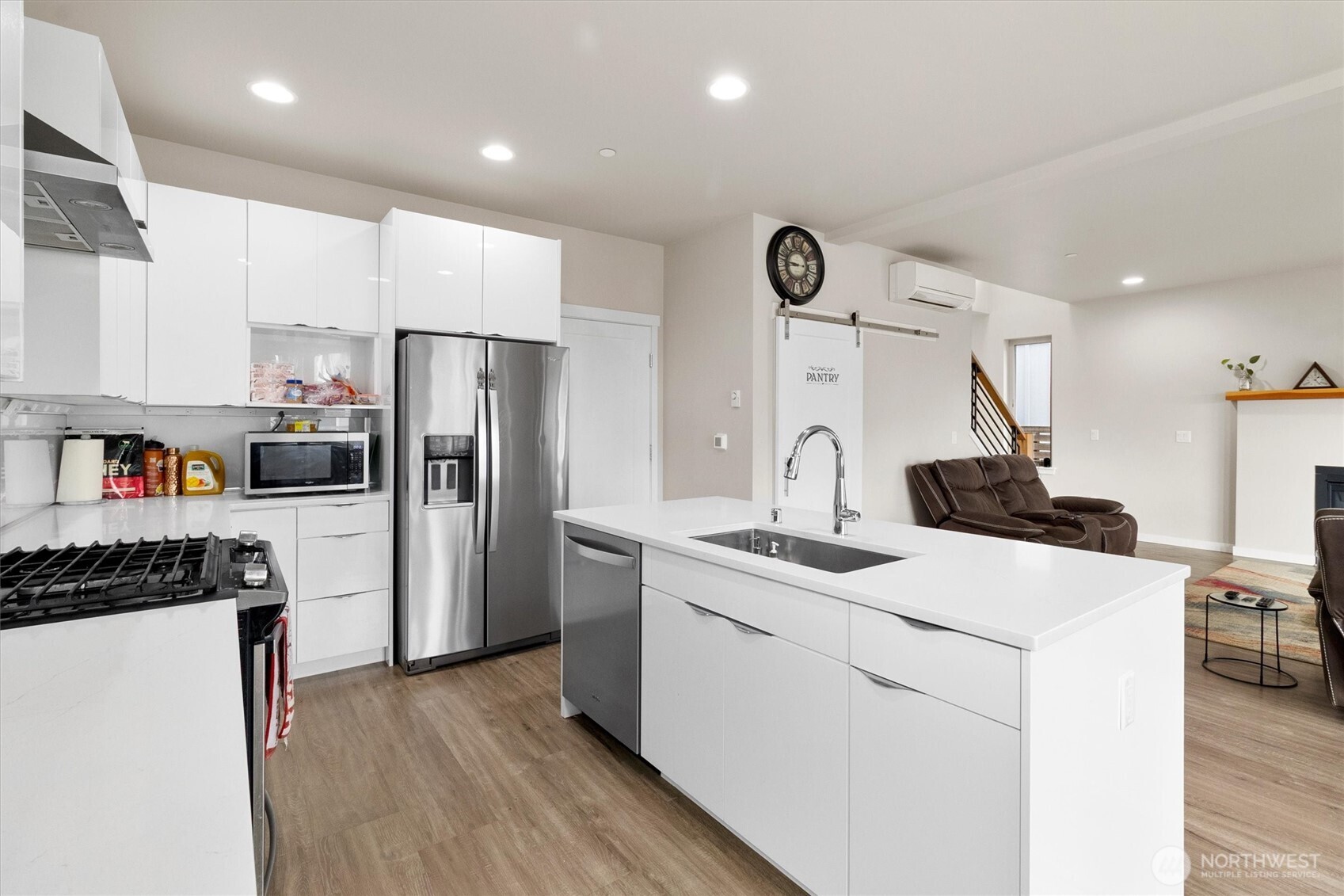 703 Northview Street Bellingham, WA 98226 - Photo 4 of 40 a kitchen with a sink a refrigerator and a stove top oven