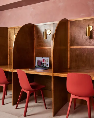 a view of a dining table and chairs in the room