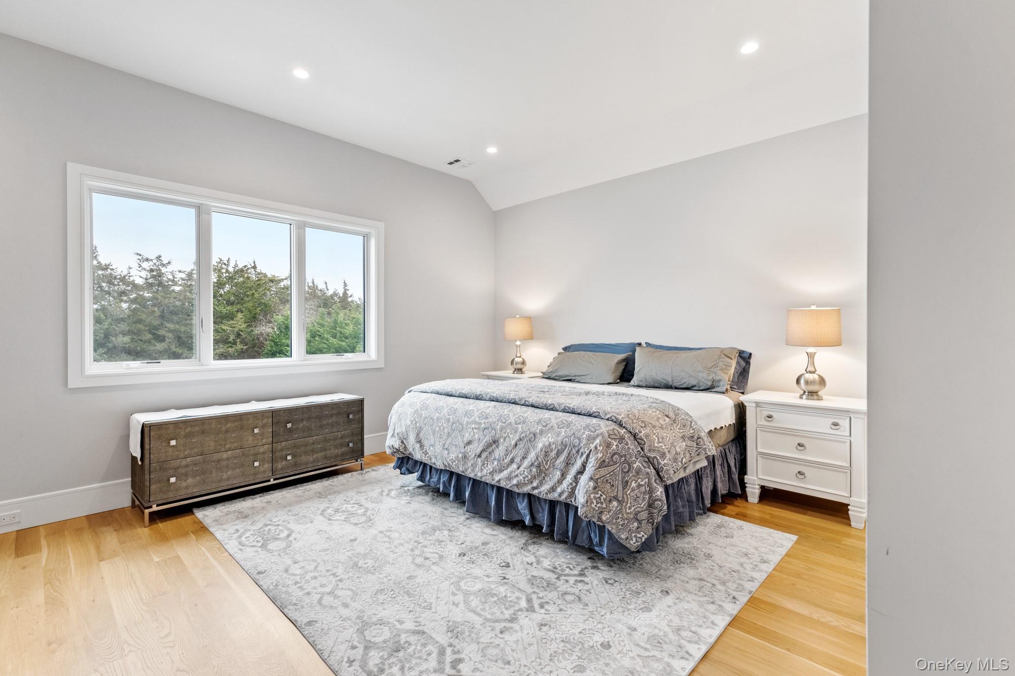 240 Head Of Pond Road Water Mill, NY 11976 - Photo 24 of 40 Bedroom featuring wood finished floors, baseboards, recessed lighting, and vaulted ceiling