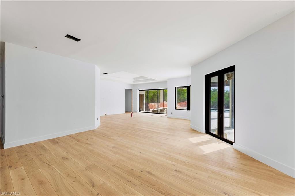 5461 Park Road Fort Myers, FL 33908 - Photo 13 of 41 a view of an empty room with window and hardwood