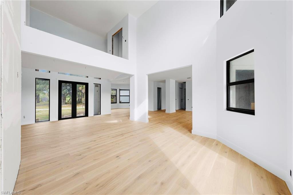 5461 Park Road Fort Myers, FL 33908 - Photo 15 of 41 a view of an empty room with wooden floor and a window