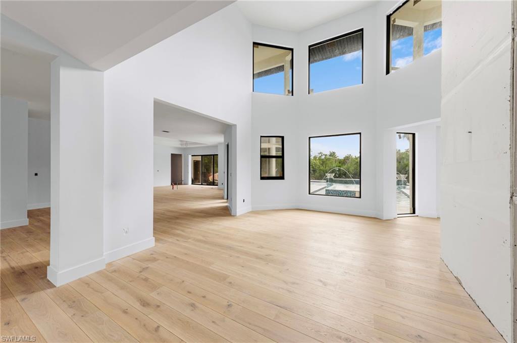 5461 Park Road Fort Myers, FL 33908 - Photo 27 of 41 a view of an empty room with wooden floor and a window