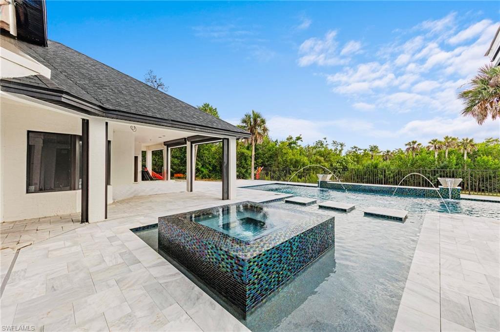 5461 Park Road Fort Myers, FL 33908 - Photo 6 of 41 a view of a patio with couches and table and chairs with wooden floor and fence