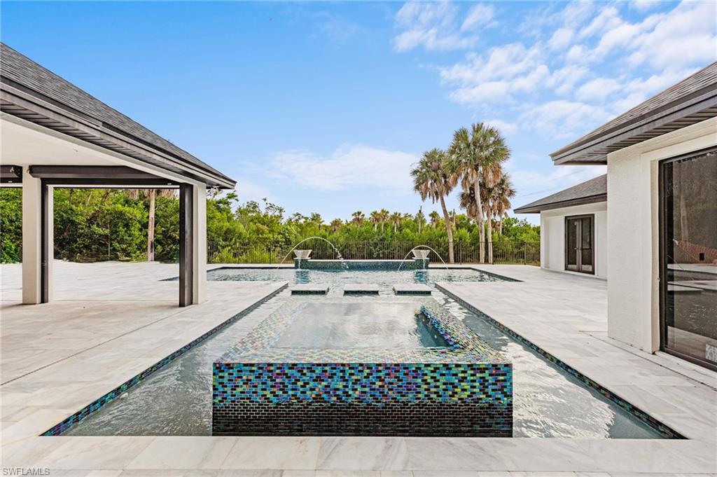 5461 Park Road Fort Myers, FL 33908 - Photo 7 of 41 a view of a house with backyard porch and sitting area