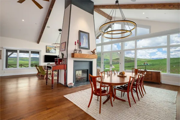 a view of a dining room with furniture window and wooden floor