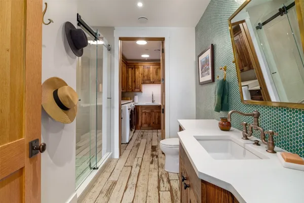a bathroom with a sink and mirror