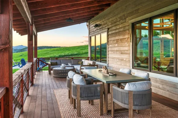 a dining room with furniture and wooden floor