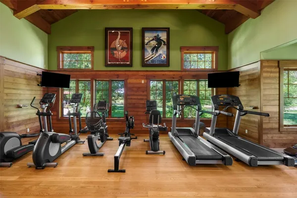 a room with gym equipment and a large window