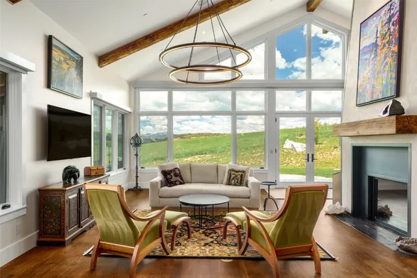 a view of a livingroom with furniture and a fireplace