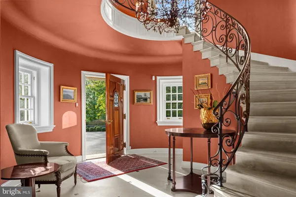 a view of a livingroom with furniture and a window