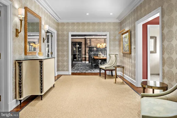 a dining room with furniture and a floor to ceiling window