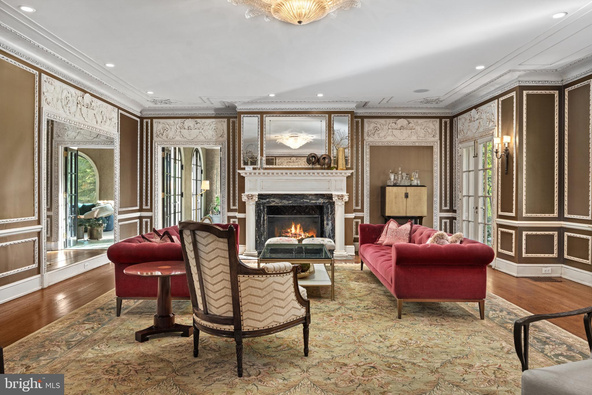 648 Creighton Road Villanova, PA 19085 - Photo 5 of 26 a living room with furniture and a fireplace
