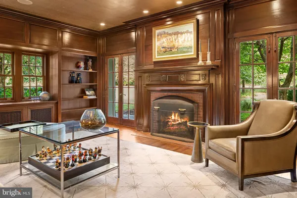 a living room with furniture a window and a fireplace