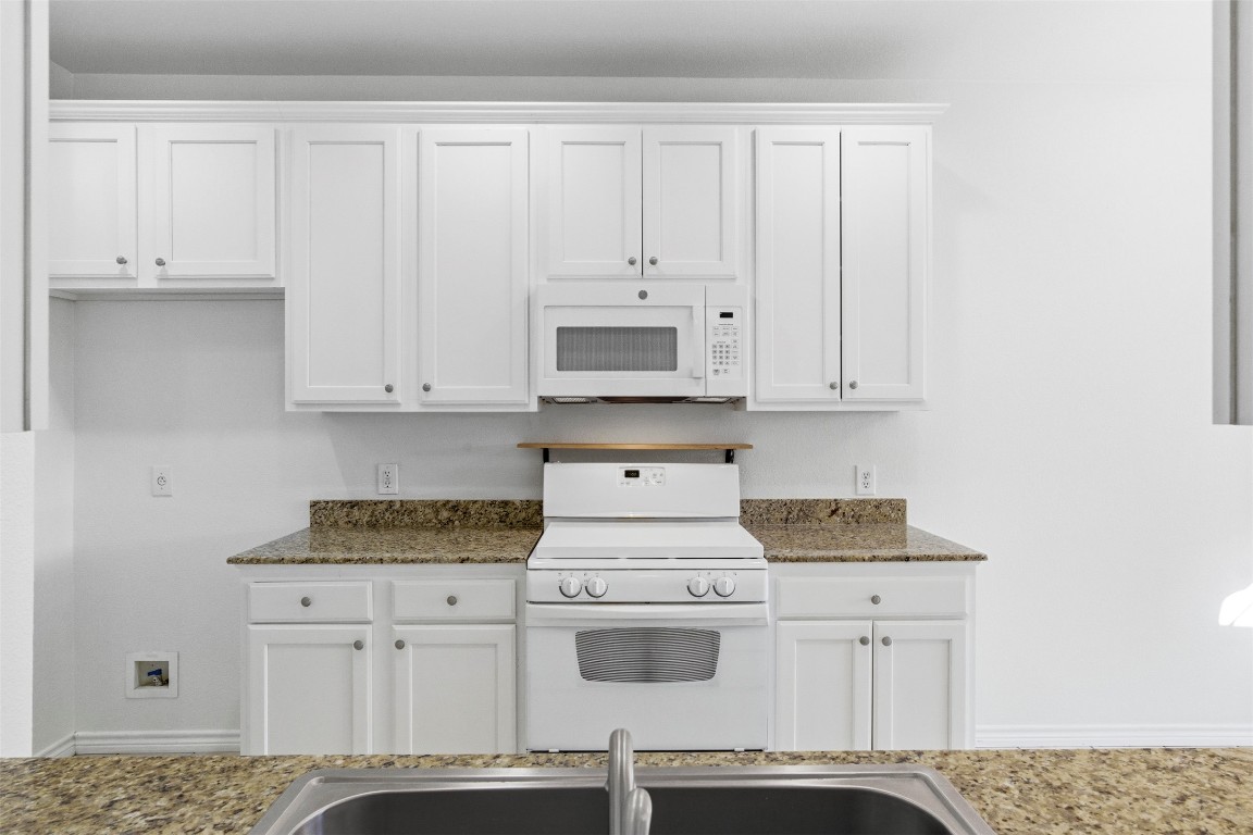 365 Rose Mayer Loop La Grange, TX 78945 - Photo 11 of 33 a kitchen with stainless steel appliances granite countertop white cabinets and a stove