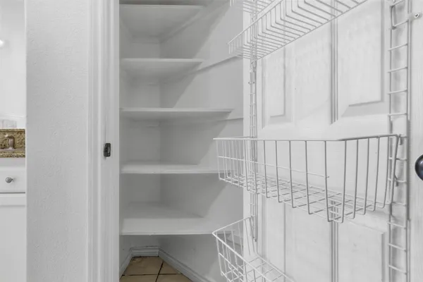 a view of a room with racks on the wall