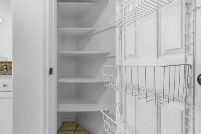 a view of a room with racks on the wall