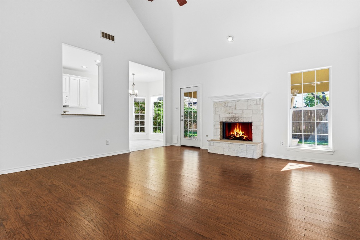 365 Rose Mayer Loop La Grange, TX 78945 - Photo 3 of 33 an empty room with windows fireplace and wooden floor