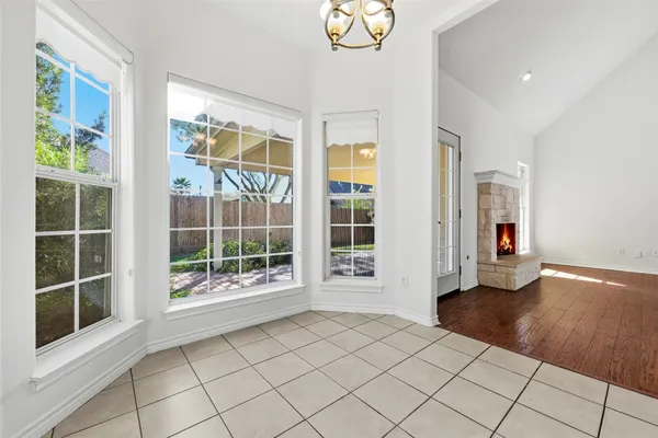 a view of an entryway with wooden floor and door