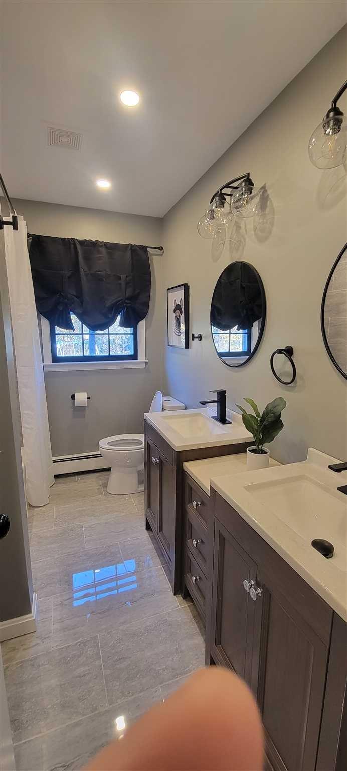 5 Haymaker Lane Plattekill, NY 12589 - Photo 15 of 37 a bathroom with a double vanity sink mirror and toilet