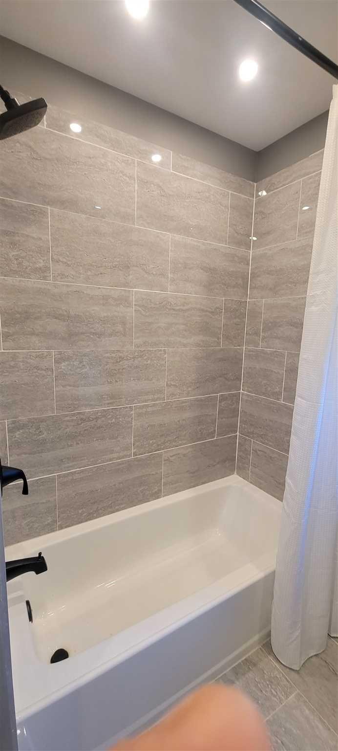 5 Haymaker Lane Plattekill, NY 12589 - Photo 16 of 37 a bathroom with a bathtub and a shower