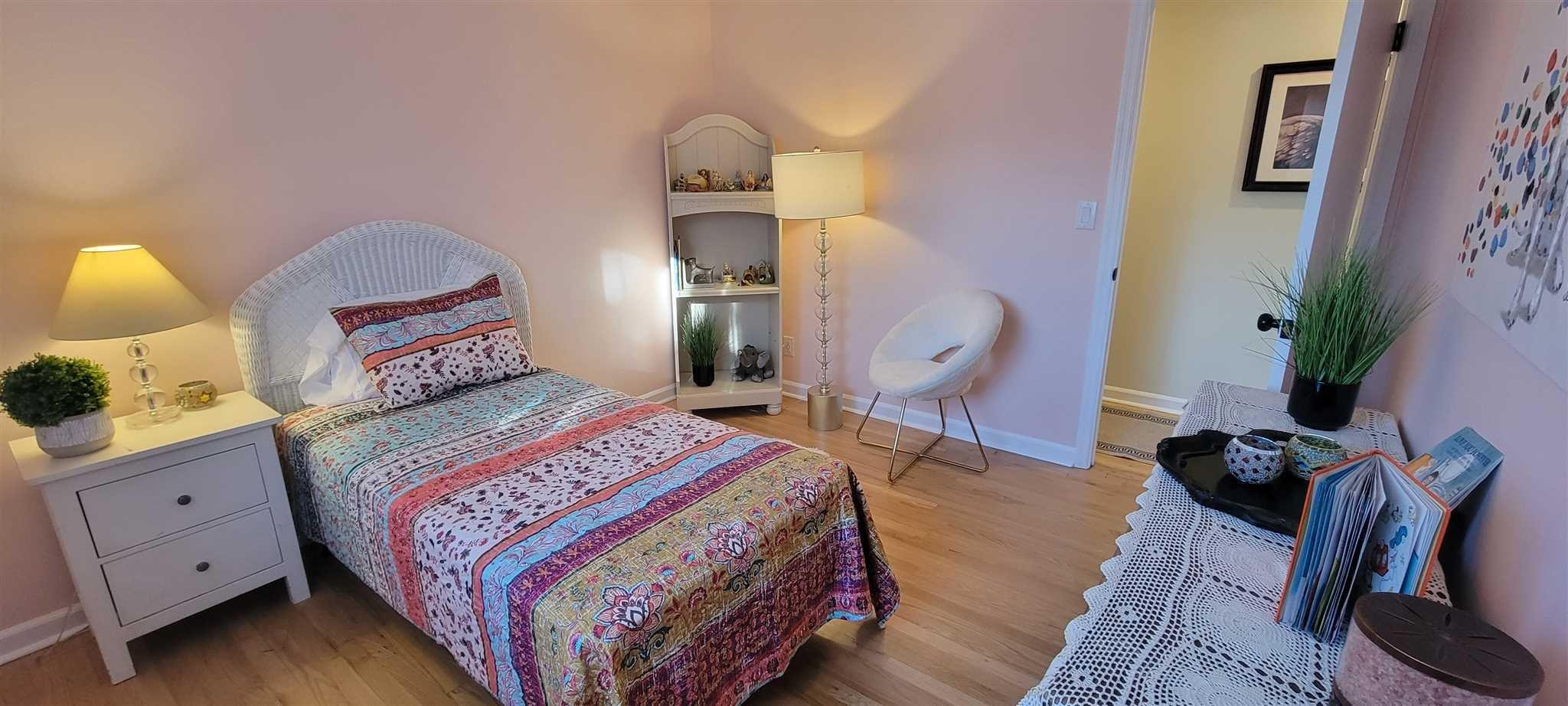 5 Haymaker Lane Plattekill, NY 12589 - Photo 24 of 37 a bedroom with a bed a dresser and wooden floor