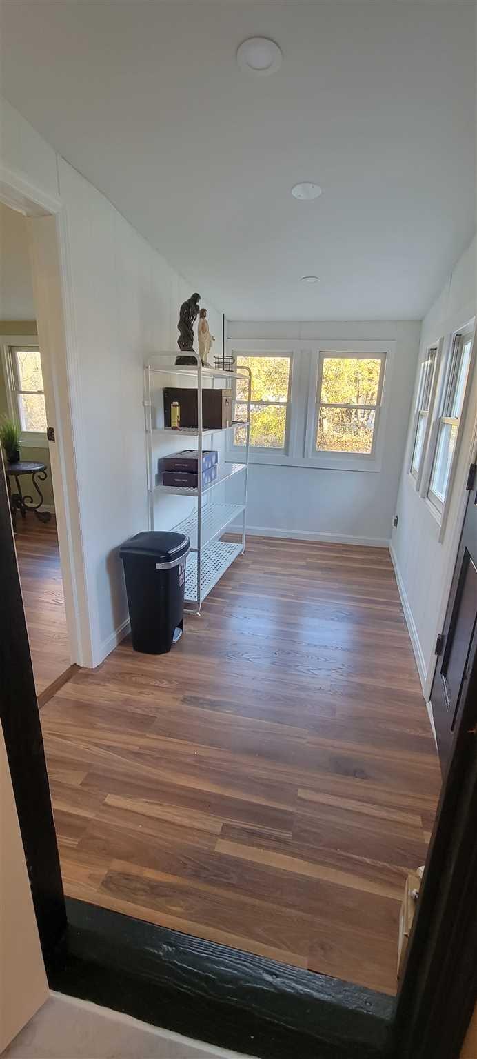 5 Haymaker Lane Plattekill, NY 12589 - Photo 25 of 37 a view of kitchen and empty room with wooden floor