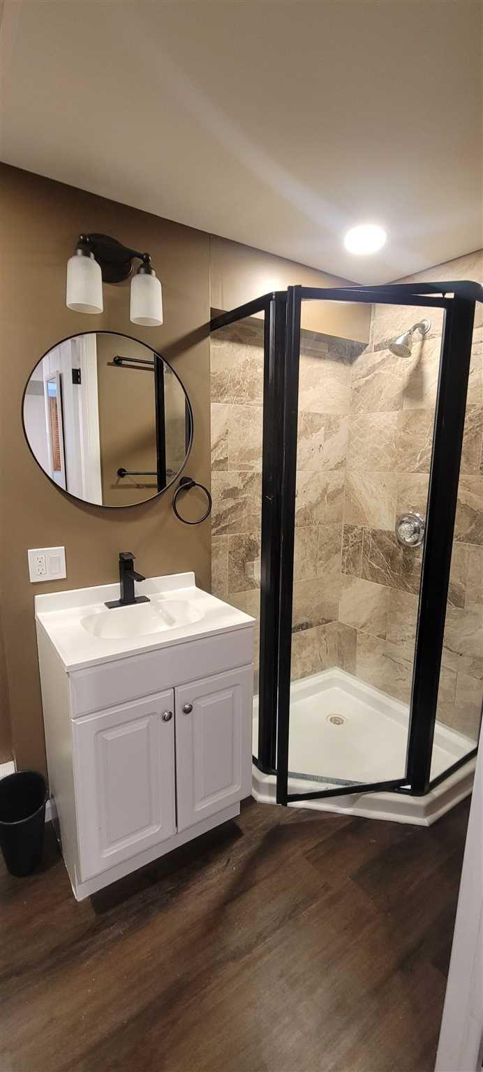 5 Haymaker Lane Plattekill, NY 12589 - Photo 30 of 37 a bathroom with a double vanity sink and mirror